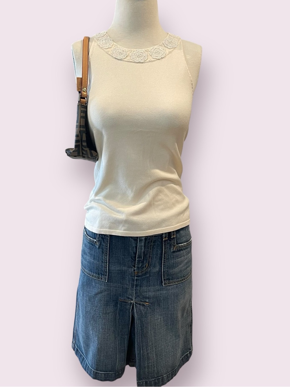 Cream knit halter neck top with a floral beaded